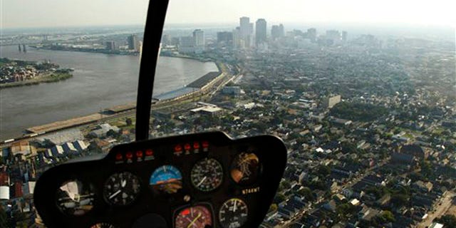 In this July 31, 2010 photo, the New Orleans skyline is seen from the cockpit of a helicopter.