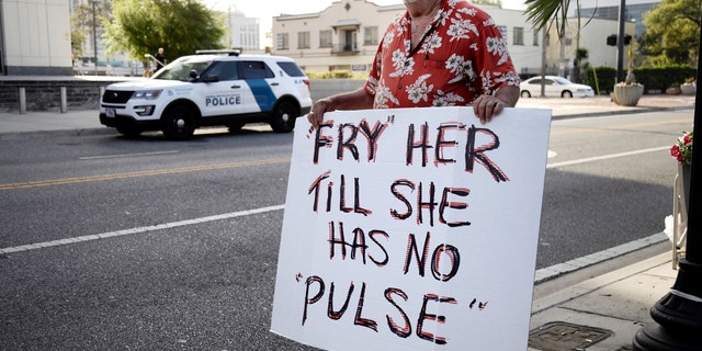 Bob Kunst protests against the widow of the Pulse nightclub shooter Noor Salman, who faces charges of aiding her husband in killing 49 people in 2016, outside the federal court house in Orlando, Florida,