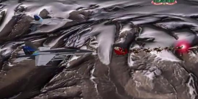 Nov. 27, 2013: Santa's sled is escorted by a pair of fighter jets in this still image taken from an handout NORAD animated video.