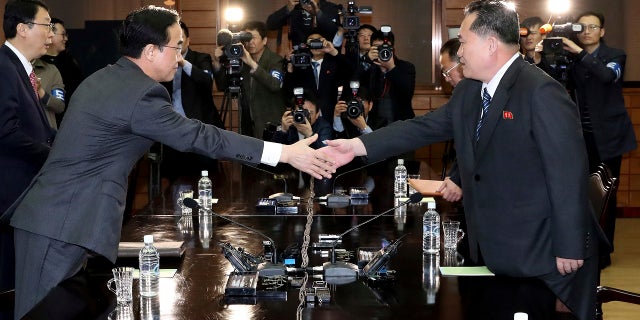 March 29: South Korean Unification Minister Cho Myoung-gyon, left, shakes hands with North Korean delegation head Ri Son Gwon before their meeting at the northern side of the Panmunjom, North Korea.