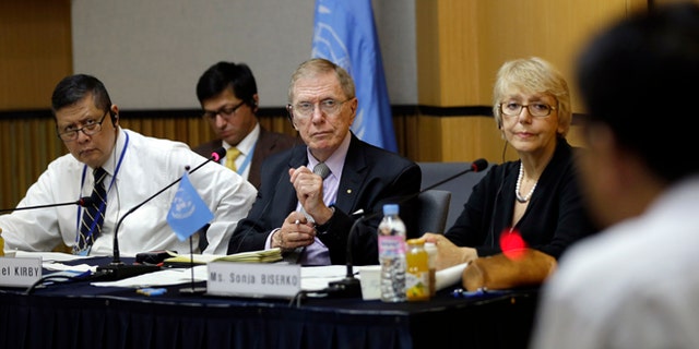 Aug. 21, 2013: In this photo, Michael Donald Kirby, center, the chairman of the U.N. commission of Inquiry on human rights in North Korea, listens to Ahn Myung-chul, right, who worked as a guard and driver at several political prisoner camps in the 1990s before defecting to south, during the U.N. hearing in Seoul, South Korea.