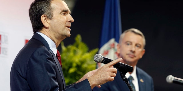 Democratic candidate for governor, Lt. Gov. Ralph Northam, left, gestures during a debate with Republican challenger Ed Gillespie at the University of Virginia-Wise in Wise, Va., Monday, Oct. 9, 2017.