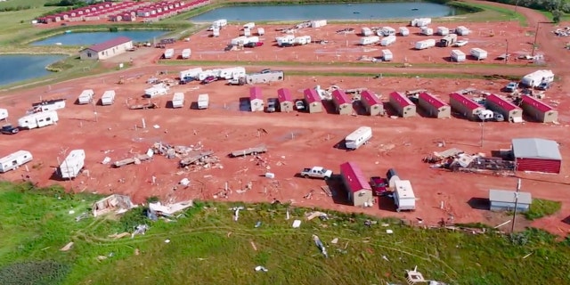 This aerial image from video, shot with a drone provided by HRI Aerial Imaging, shows damage at an RV park Tuesday, July 10, 2018, in Watford City, N.D..
