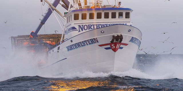 Northwestern cuts through small waves.