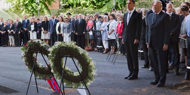 July 22, 2012: Norwegian King Harald, right, and Norwegian Prime Minister Jens Stoltenberg stand together during a wreath laying ceremony to mark the first anniversary of the bomb and shooting tragedy in Oslo and on the Utoeya Island, near the heavily damaged government office building in Oslo.