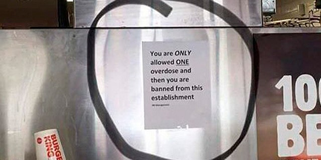A Burger King in Worcester, Mass. has removed a sign about overdosing that was hanging behind the counter.