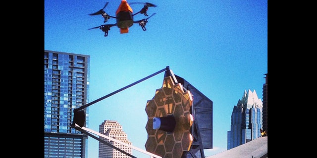 NSF drone flies over the James Webb Space Telescope replica in Austin.