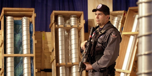 Security team member Pat Galardo guards components of the nuclear weapons program at the Y-12 National Security Complex in Oak Ridge, Tennessee, March 15, 2004.