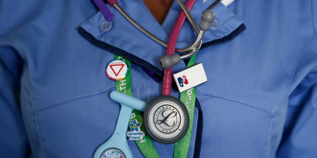 File photo - A nurse wears a watch and stethoscope at St Thomas' Hospital in central London January 28, 2015. (REUTERS/Stefan Wermuth)