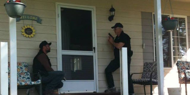 North Valley Community watch members prepare to check on a home.