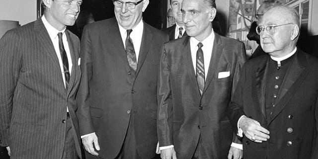 U.S. Sen. Robert K. Kennedy, from left, Supreme Court Chief Justice Earl Warren, Assembly Speaker Anthony J. Travia, and Francis Cardinal Spellman attend New York State's Ninth Constitutional Convention at the Capitol in Albany, N.Y.
