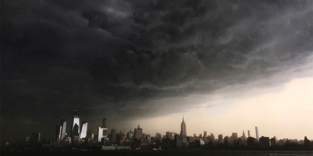 Storm clouds seen gathering over New York City on Tuesday. The National Weather Service on Wednesday said three tornadoes hit parts of New York amid storms across the Northeast on Tuesday.