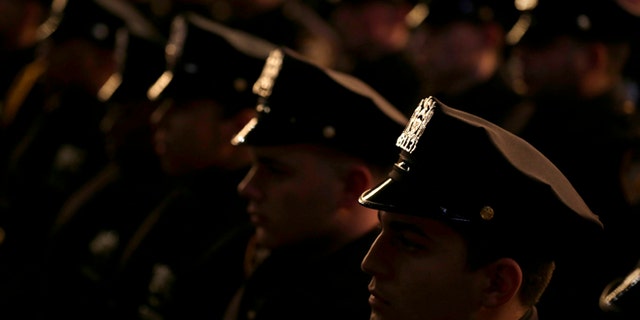 New graduates of the NYPD Police Academy participate in a ceremony.