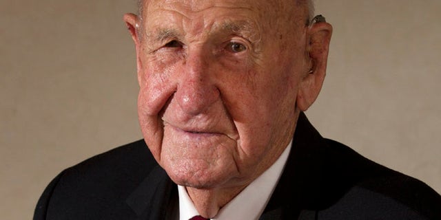 March 3: Veteran Les Munro poses for a photo at his home in Tauranga, New Zealand.