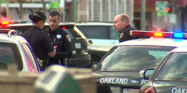 June 14, 2016: Police respond to the scene of a shooting in downtown Oakland, Calif.