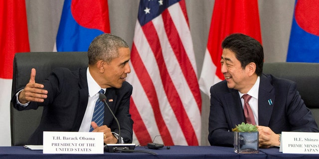 FILE - March 31, 2016: President Obama speaks with Japanese Prime Minister Shinzo Abe during their meeting at the Nuclear Security Summit in Washington. (AP Photo/Jacquelyn Martin)