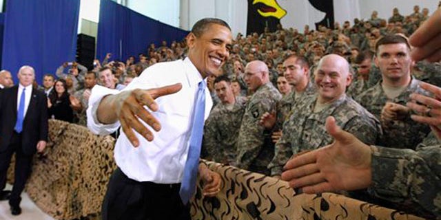 President Obama greets military personnel before addressing the troops.