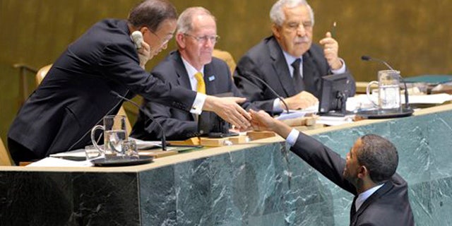 Sept. 22, 2010: President Barack Obama reaches to shake the hand of UN Secretary General Ban-Ki Moon, left, before he delivers remarks at the Millennium Development Goals Conference at the United Nations.