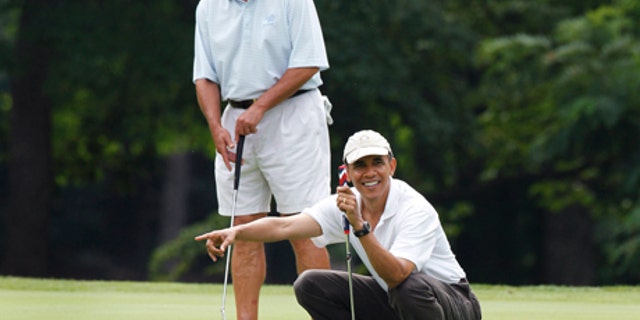 House Speaker John Boehner, R-Ohio, and President Obama enjoy a bipartisan golf match Saturday June 11. (AP Photo)