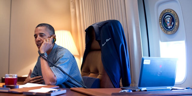 President Obama calls the NASA scientists behind the Curiosity Mars rover landing from Air Force One Aug. 13, 2012.