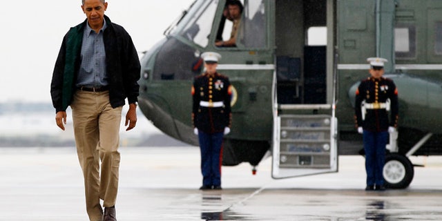 President Barack Obama walks from Marine One to board Air Force One at O'Hare International Airport in Chicago, Monday, Aug. 13, 2012 en route to Offutt Air Force Base in Bellevue, Neb., and onto a three day campaign bus tour through Iowa.