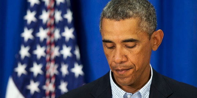 Aug. 14, 2014: President Obama pauses as he speaks about the situations in Iraq and in Ferguson, Mo. in Edgartown, Mass., during his family vacation on the island of Martha's Vineyard.