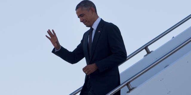 Nov. 15, 2014: U.S. President Barack Obama waves as he arrives at Royal Australian Air Force Base Amberley near Brisbane, Australia