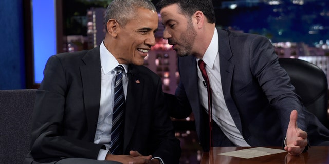 President Obama talks with Jimmy Kimmel in between taping segments of Jimmy Kimmel Live! in Los Angeles.