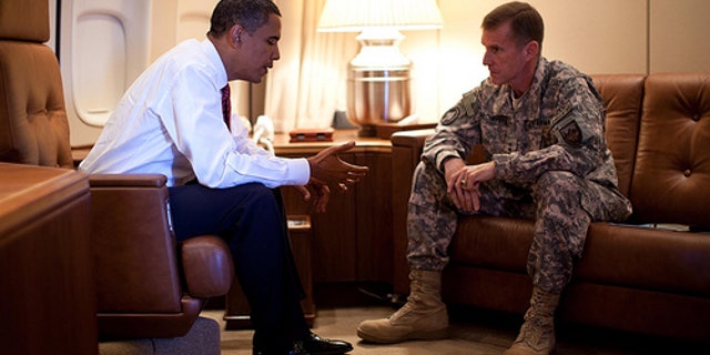President Barack Obama meets with Army Gen. Stanley McChrystal, the Commander of U.S. Forces in Afghanistan, aboard Air Force One in Copenhagen, Denmark on Oct. 2, 2009.
