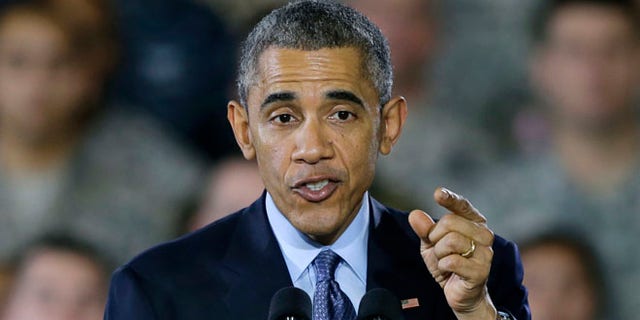 Dec. 15, 2014: President Obama speaks to military members and families at Joint Base McGuire-Dix-Lakehurst, in Wrightstown, N.J.