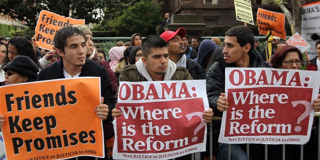 SAN FRANCISCO - MAY 25: A group carries signs asking for immigration reform as they protest outside of the Fairmont Hotel before U.S. President Barack Obama arrives for a fundraiser May 25, 2010 in San Francisco, California. Hundreds of protestors from different political groups staged the demonstration at a campaign fundraiser for U.S. Sen. Barbara Boxer (D-CA). (Photo by Justin Sullivan/Getty Images)