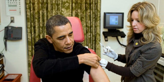 A White House nurse preps President Obama for the H1N1 flu shot. White House Photo.