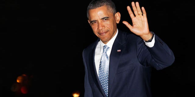 May 11: President Obama waves to media as he walks from Marine One to the White House, in Washington, as he travels from Texas.