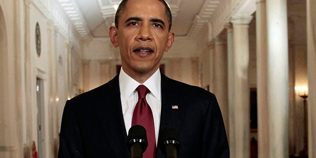 May 1: President Barack Obama reads his statement to photographers after making a televised statement on the death of Osama bin Laden from the East Room of the White House