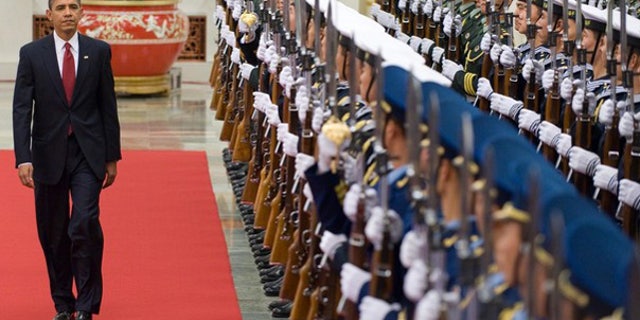 Nov. 17: President Barack Obama walks past an honor guard at a welcoming ceremony at the Great Hall of the People prior to meetings in Beijing. (AFP)