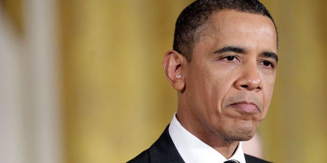 President Barack Obama pauses as he speaks on America's Great Outdoors initiative during a ceremony in the East Room of the White House in Washington, Wednesday, Feb. 16, 2011. (AP)