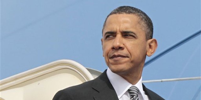 President Obama prepares to board Air Force One before his departure from Andrews Air Force Base March 8.