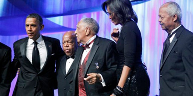 Saturday: President Obama, Rep. John Lewis, D-Ga., civil rights leader Rev. Joseph E. Lowery, first lady Michelle Obama, and CBC Foundation Chairman Rep. Donald M. Payne, D-N.J., stand on-stage during the Congressional Black Caucus Foundation Foundation Annual Phoenix Awards in Washington.
