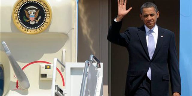 President Obama waves as he walks off Air Force One at Andrews Air Force Base June 2, after a trip to Pittsburgh. (AP Photo)