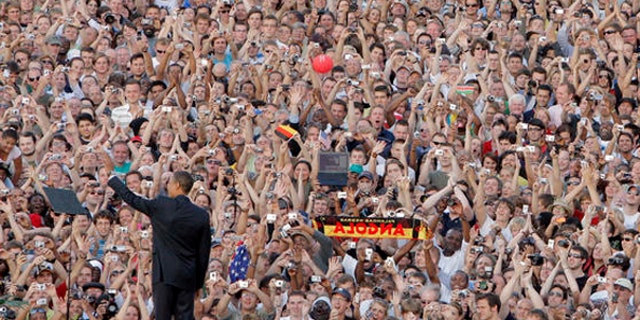 In this July 24, 2008, photo, then-Sen. Barack Obama is seen greeting the crowd in Berlin. (AP Photo)
