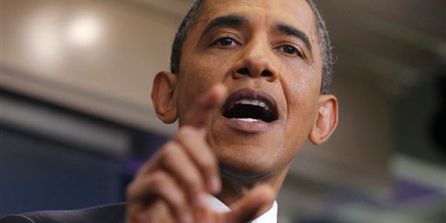 President Obama gestures during a news conference in the James Brady Press Briefing Room of the White House July 11.