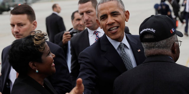 Sept. 28, 2016: President Barack Obama greets people on the tarmac as he arrives on Air Force One at Richmond International Airport, in Richmond, Va.