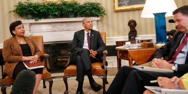 July 19, 2016: President Barack Obama, center, with Attorney General Loretta Lynch, left, and FBI Director James Comey, right, sit during their meeting in the Oval Office of the White House in Washington