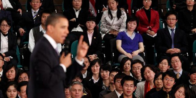 Monday: President Obama speaks at a town hall style event with Chinese youth at the Museum of Science and Technology in Shanghai, China. (AP Photo)