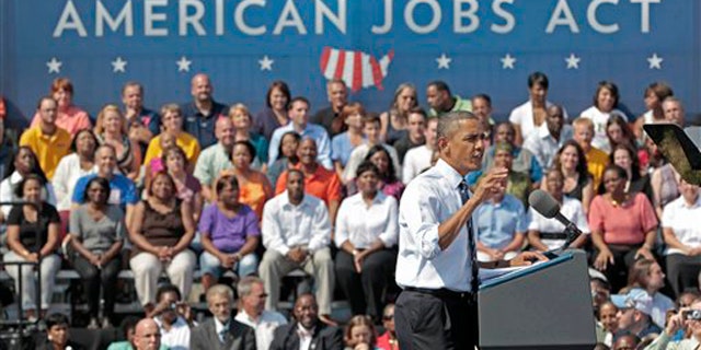President Obama gestures as he speaks at Fort Hayes Arts and Academic High School in Columbus, Ohio, Sept. 13.