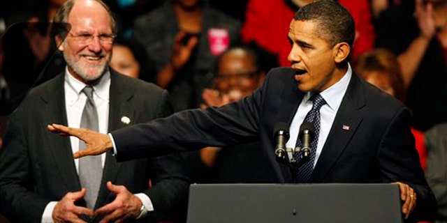 Gov. Jon Corzine listens to President Obama at a campaign rally Nov. 1 in Camden, N.J. (AP Photo)