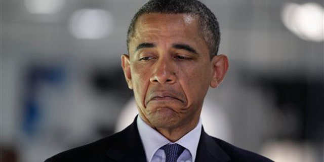 President Obama pauses during a tour at the manufacturing facilities of Cree June 13 in Durham, N.C.