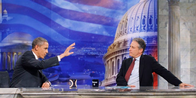 Wednesday: President Obama gestures during a commercial break as he talks with host Jon Stewart at a taping of Comedy Central's "The Daily Show with Jon Stewart," in Washington.