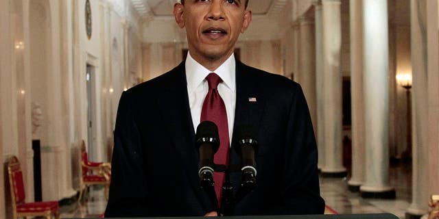 FILE: This May 1, 2011, photo of President Obama shows a him reading a portion of a speech to press photographers, after making a televised address to the entire country on the death of Usama bin Laden, from the East Room of White House.