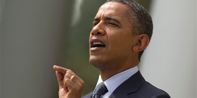 President Obama gestures while speaking in the Rose Garden of the White House in Washington Sept. 19.